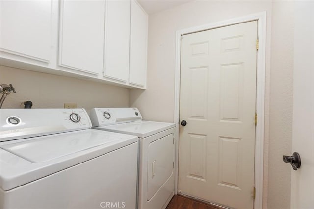 clothes washing area with cabinet space and separate washer and dryer