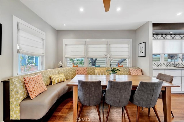 dining space with recessed lighting and wood finished floors