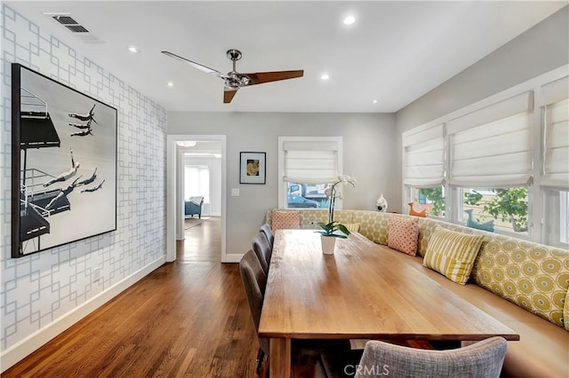 dining space with a ceiling fan, wood finished floors, visible vents, baseboards, and recessed lighting