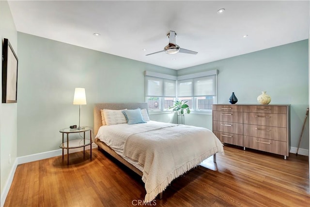 bedroom with recessed lighting, a ceiling fan, baseboards, and wood finished floors