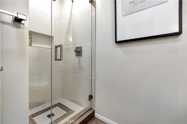 full bath with a shower stall