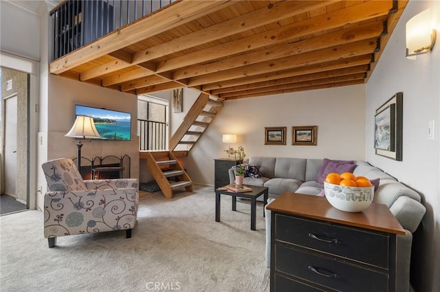 living room featuring carpet flooring, beam ceiling, wooden ceiling, and stairs