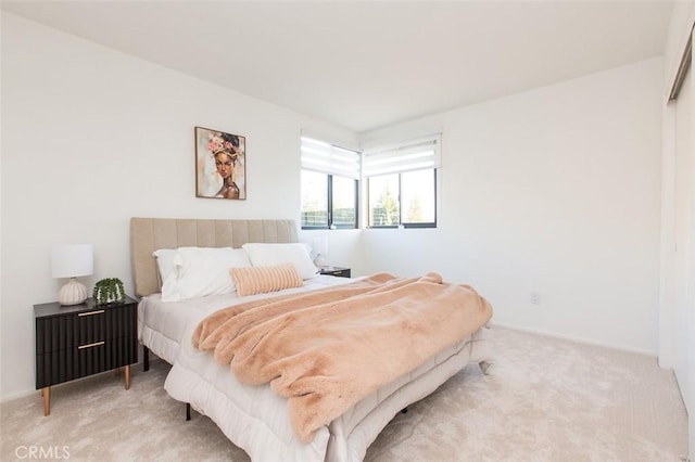 bedroom with baseboards and carpet floors