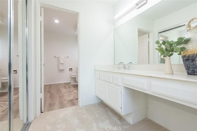 full bathroom featuring recessed lighting, toilet, and vanity