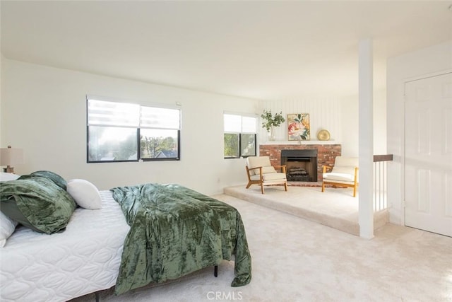 carpeted bedroom featuring a fireplace