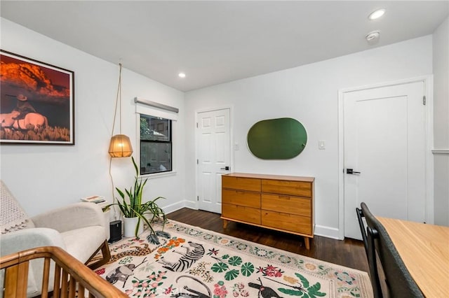 bedroom featuring dark wood finished floors, recessed lighting, and baseboards