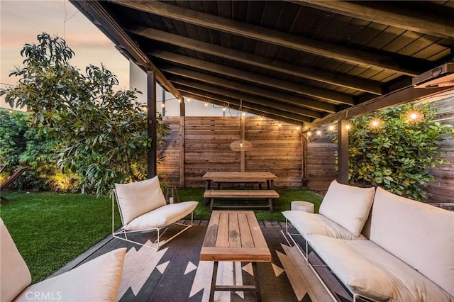 view of patio with an outdoor living space and fence