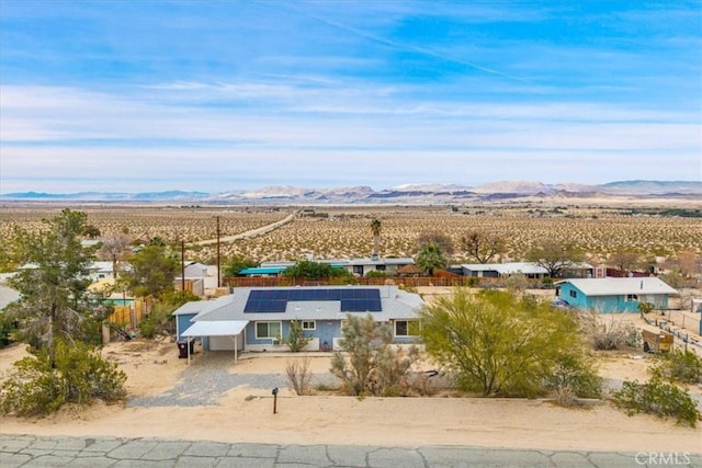 birds eye view of property with a mountain view