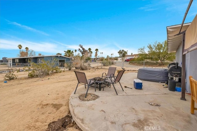 view of patio / terrace featuring a fenced backyard and an outdoor fire pit