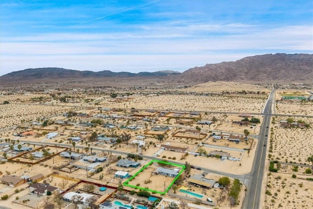 bird's eye view with a mountain view and a desert view