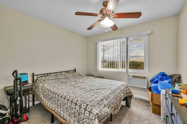bedroom featuring ceiling fan, baseboards, carpet flooring, and a wall unit AC