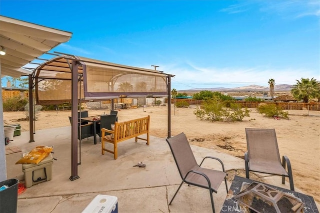 view of patio featuring fence