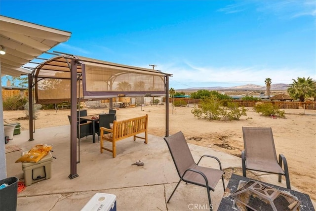 view of patio featuring a fenced backyard and outdoor dining area