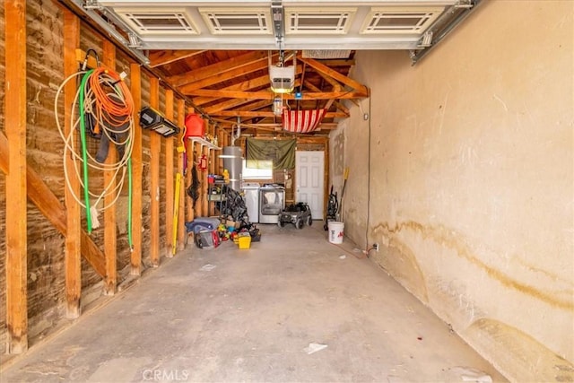 garage with washer and clothes dryer