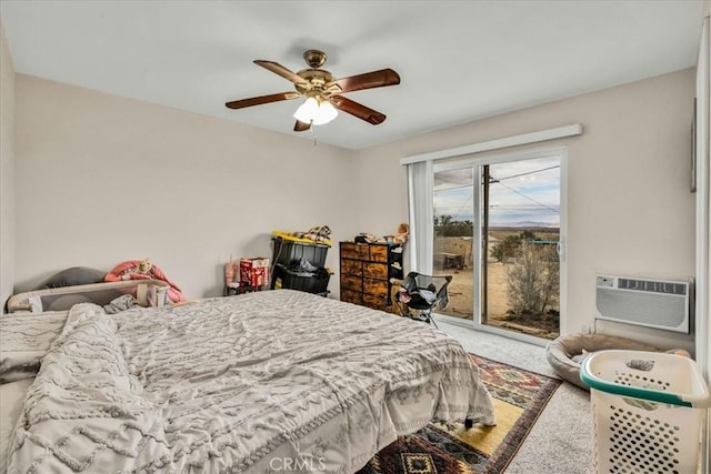 bedroom with an AC wall unit, carpet floors, access to outside, and ceiling fan