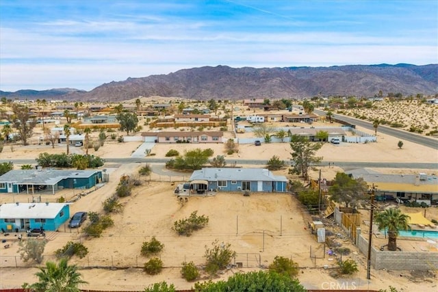 birds eye view of property featuring a mountain view