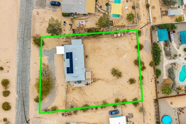 birds eye view of property with a desert view