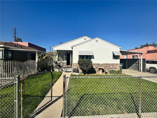 view of front of house featuring stucco siding, stone siding, a front lawn, and fence