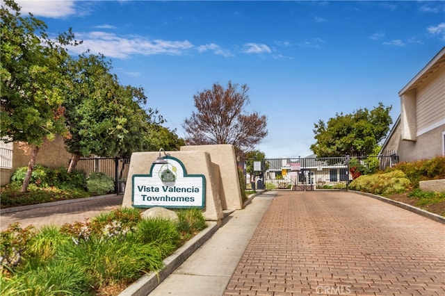 23212 Kimmore Ter, Valencia, CA 91355 - exterior space featuring a gate, fence, and a residential view