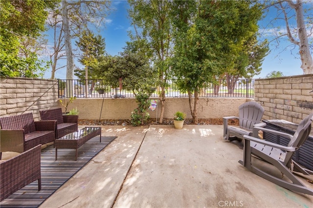 view of patio with a fenced backyard and outdoor lounge area