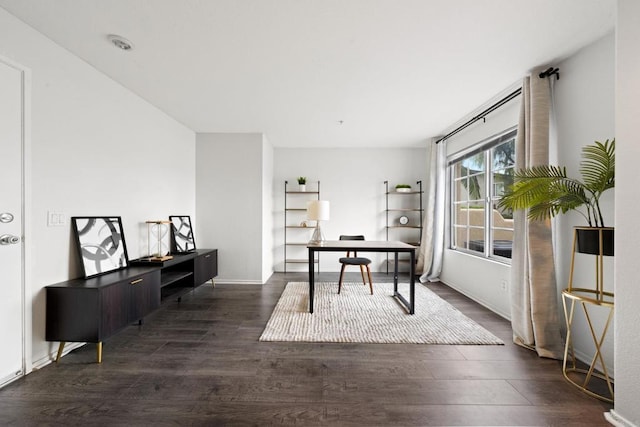 home office with dark wood finished floors and baseboards