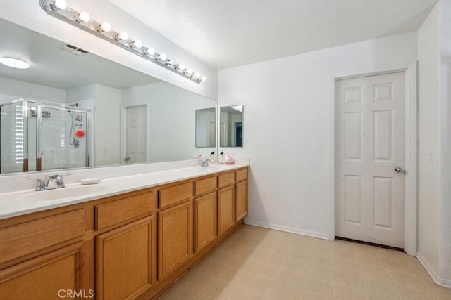 bathroom with tile patterned floors, visible vents, a sink, a shower stall, and double vanity