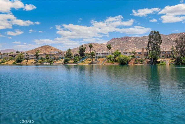 property view of water featuring a mountain view and a residential view