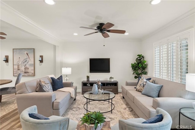 living area with recessed lighting, a ceiling fan, wood finished floors, and crown molding