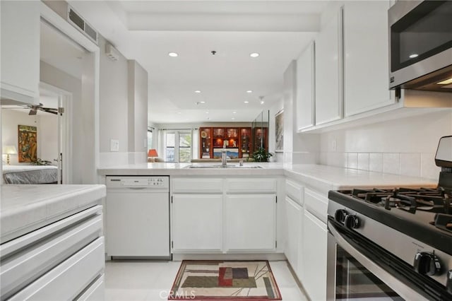 kitchen with recessed lighting, visible vents, white cabinets, and appliances with stainless steel finishes