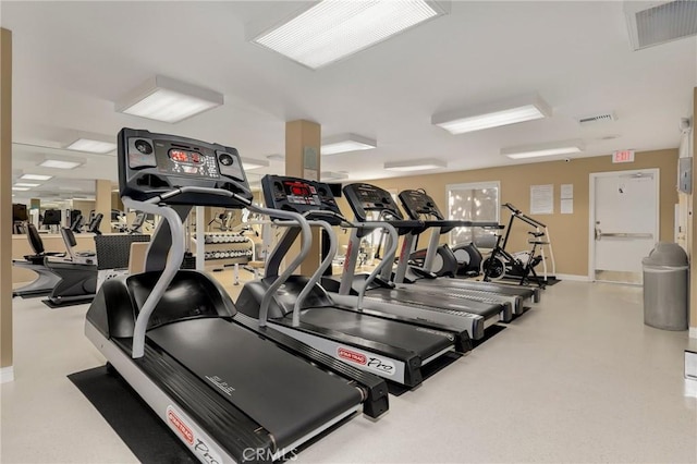 exercise room featuring baseboards and visible vents