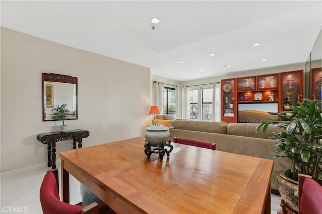 dining room featuring recessed lighting, baseboards, and light tile patterned flooring