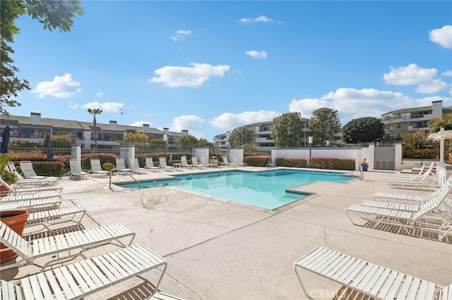 pool featuring a patio and fence