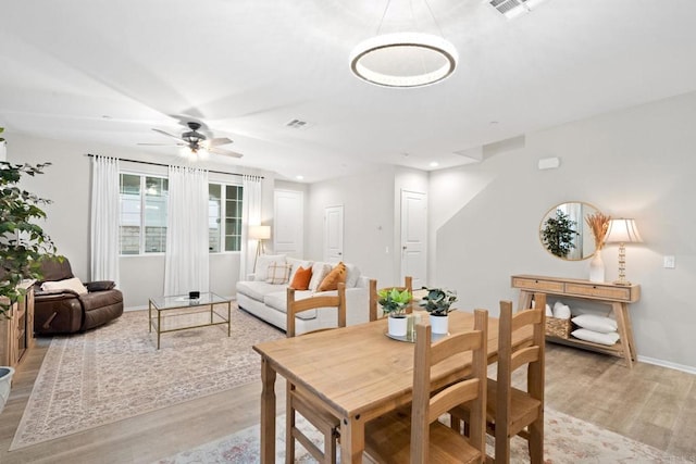 dining space featuring recessed lighting, baseboards, light wood finished floors, and ceiling fan