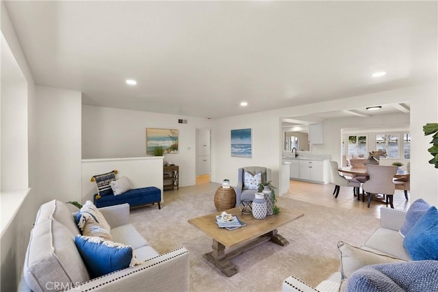 living room featuring light carpet, recessed lighting, and visible vents
