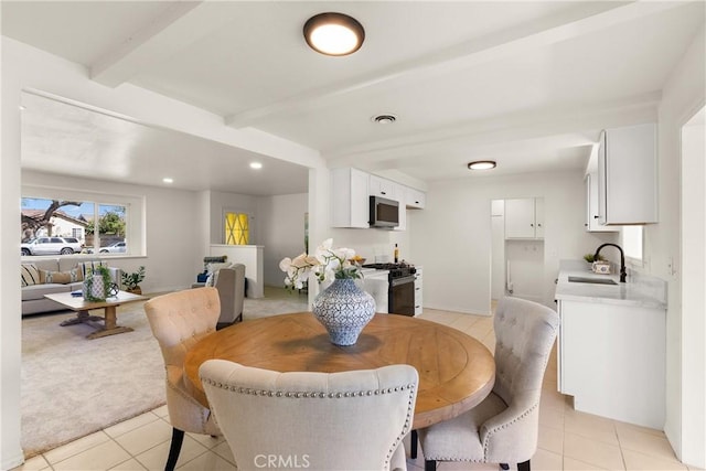 dining room featuring light tile patterned floors, recessed lighting, visible vents, and beamed ceiling