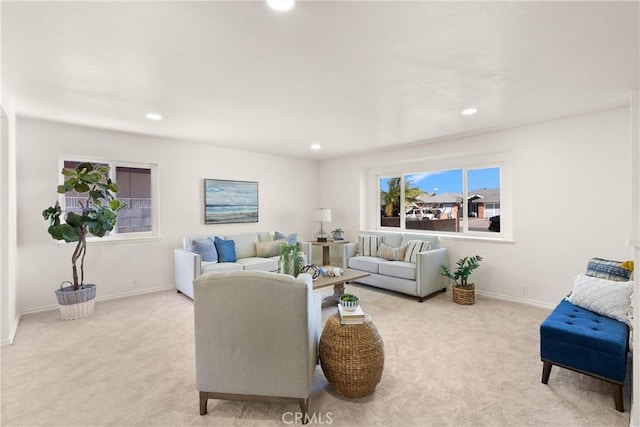 living area with light colored carpet, baseboards, and recessed lighting