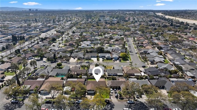 birds eye view of property with a residential view