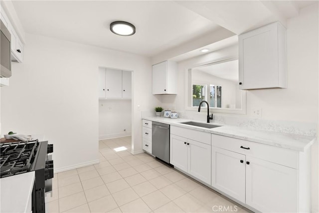 kitchen with white cabinets, baseboards, dishwasher, a sink, and light stone countertops