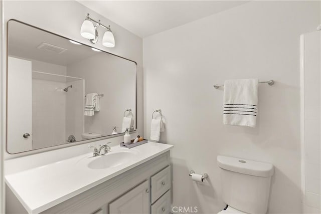 full bathroom featuring toilet and vanity