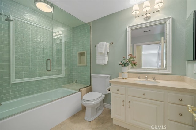 bathroom with vanity, visible vents, bath / shower combo with glass door, tile patterned flooring, and toilet