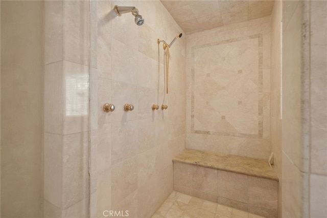 bathroom with a tile shower