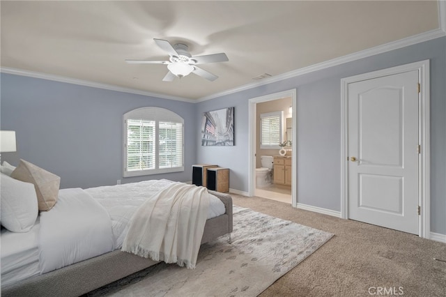 bedroom with visible vents, light colored carpet, baseboards, and ornamental molding