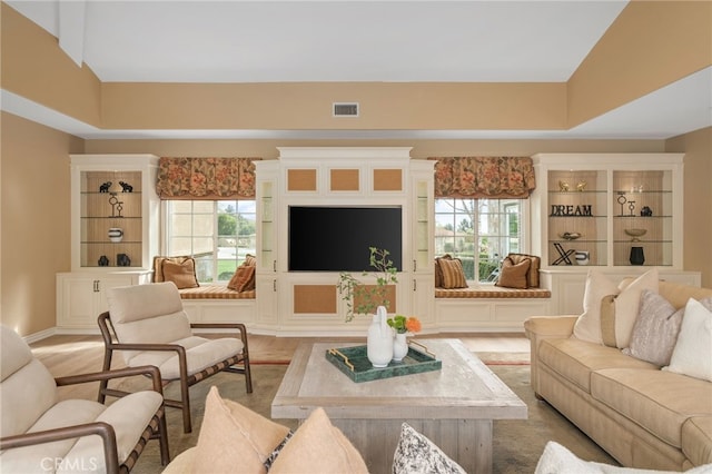 living room with visible vents and light wood-style floors