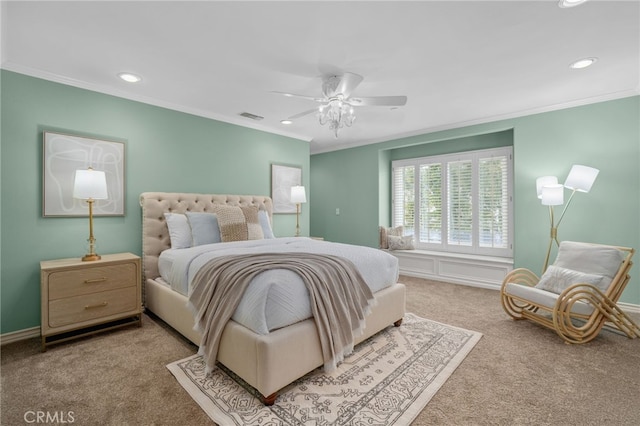 carpeted bedroom with visible vents, recessed lighting, ceiling fan, and ornamental molding