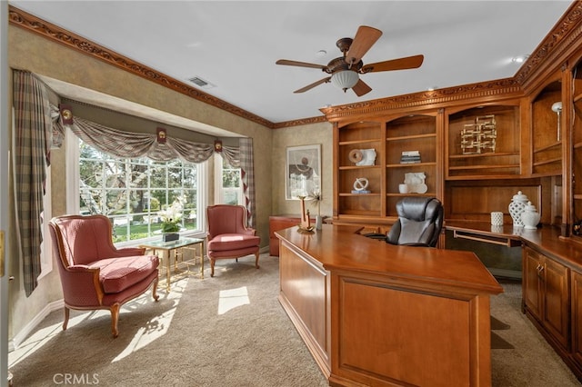 office space with a ceiling fan, light colored carpet, visible vents, and baseboards