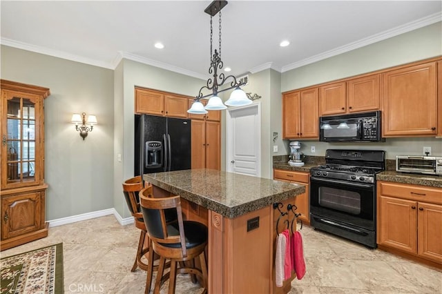 kitchen with black appliances, ornamental molding, a center island, a toaster, and baseboards