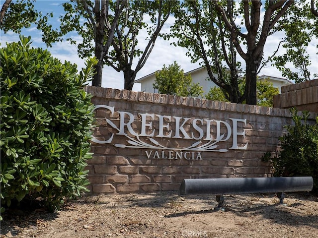 community sign with fence