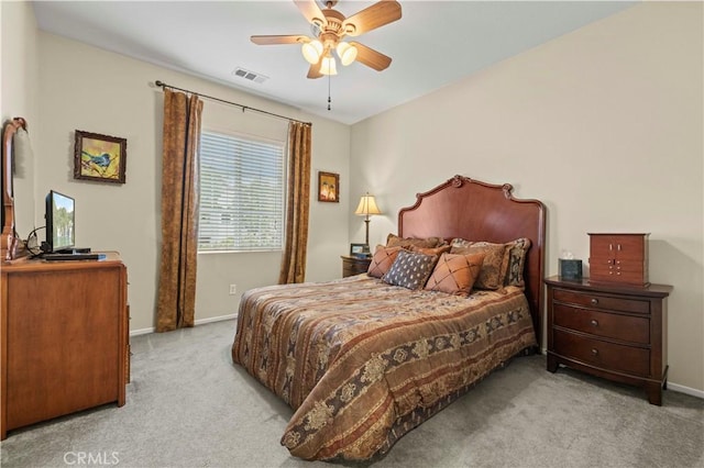 bedroom with baseboards, visible vents, carpet floors, and ceiling fan