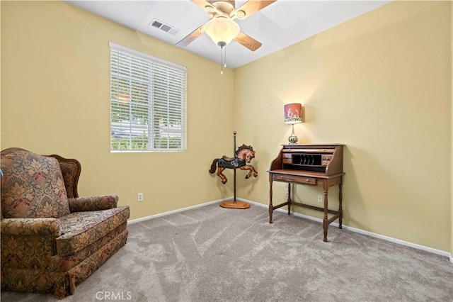 living area with visible vents, baseboards, ceiling fan, and carpet flooring