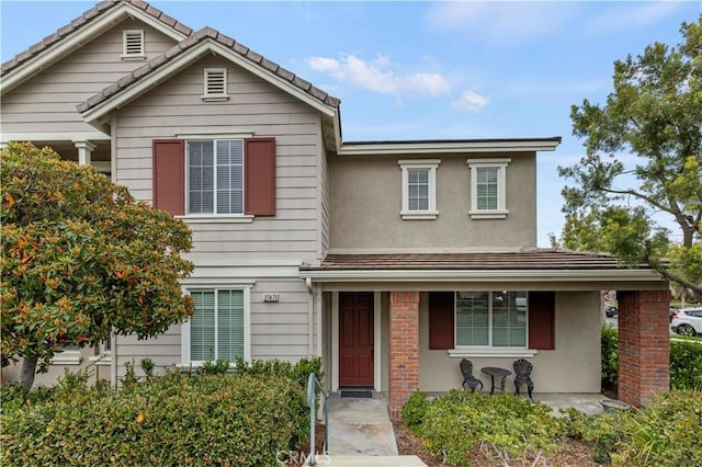 traditional-style house with stucco siding